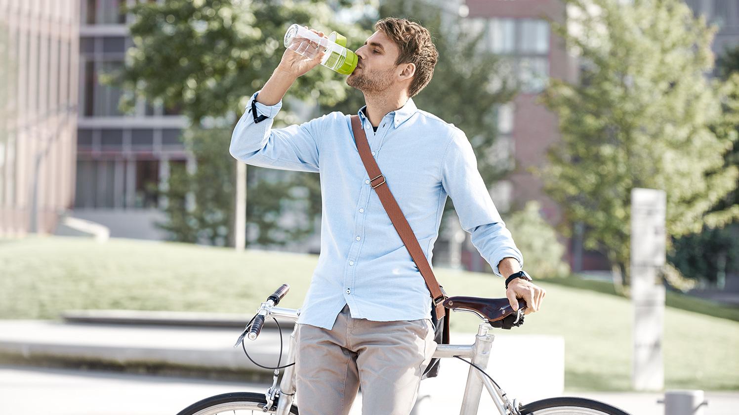 BRITA healthier planet man on bike drinking water